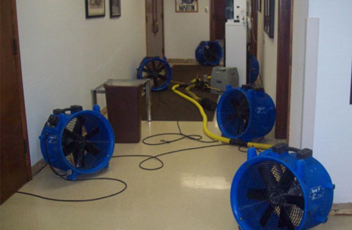Water damage restoration using equipment