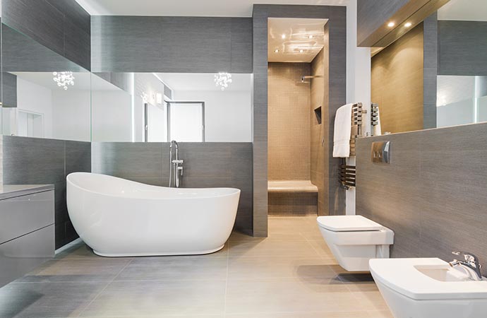 A modern bathroom interior with varity of grey tiles