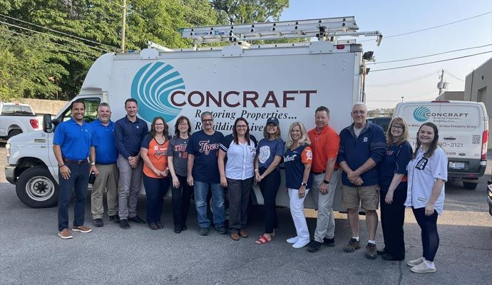 Concraft team standing in front of their service vehicle