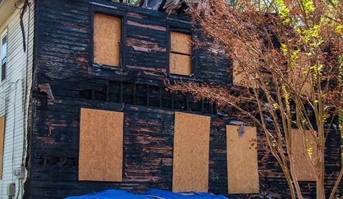 Fire damaged house board up service