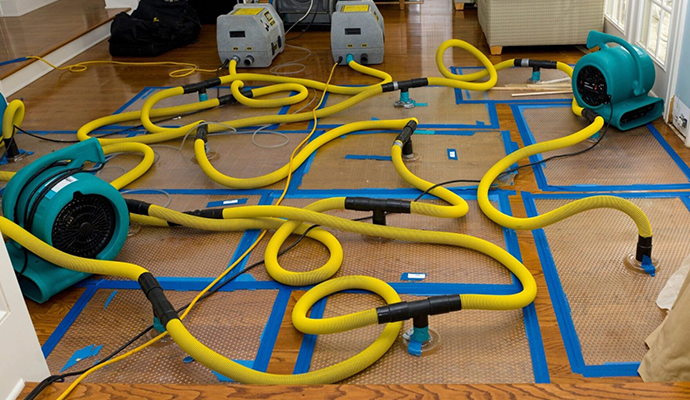 Water damage restoration service using equipment