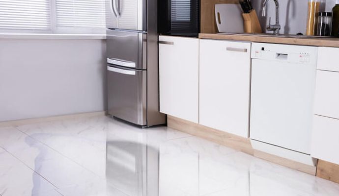 Water damaged floor due to appliance leakage
