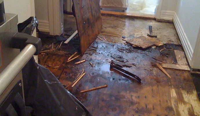 Water damaged wooden floor inside home